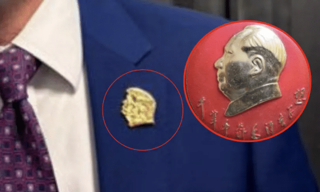FCC official appears with golden Trump pin that some likened to Mao
